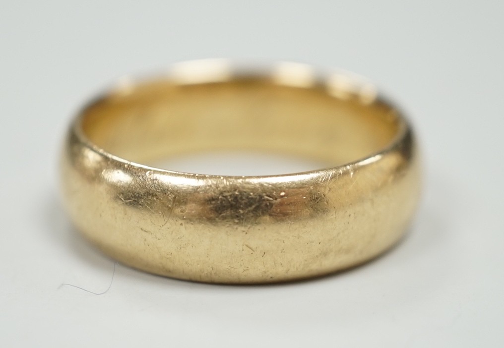 A 14k wedding band, stamped 'Columbia' and inscribed 'All my love Nancy', size U, 11.6 grams.